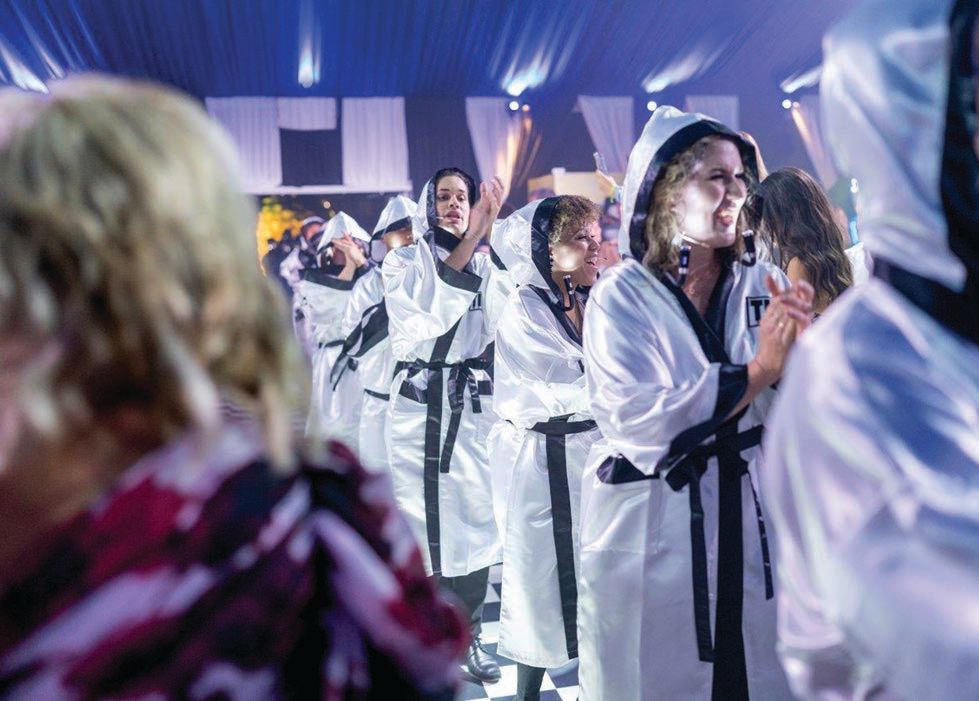 Gospel singers make their way through the tent singing hit songs like “We Will Rock You” and “Seasons of Love” PHOTO BY RON ESPOSITO