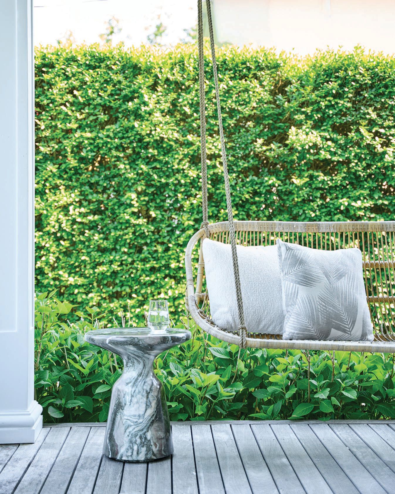 A porch swing completes the outdoor patio. PHOTOGRAPHED BY MARCO RICCA