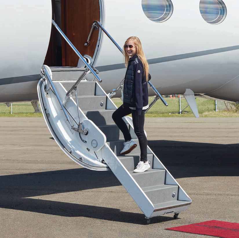Jessica Fisher poses with a Gulfstream G-450. PHOTO REPUBLIC AIRPORT/COURTESY OF FLYJETS