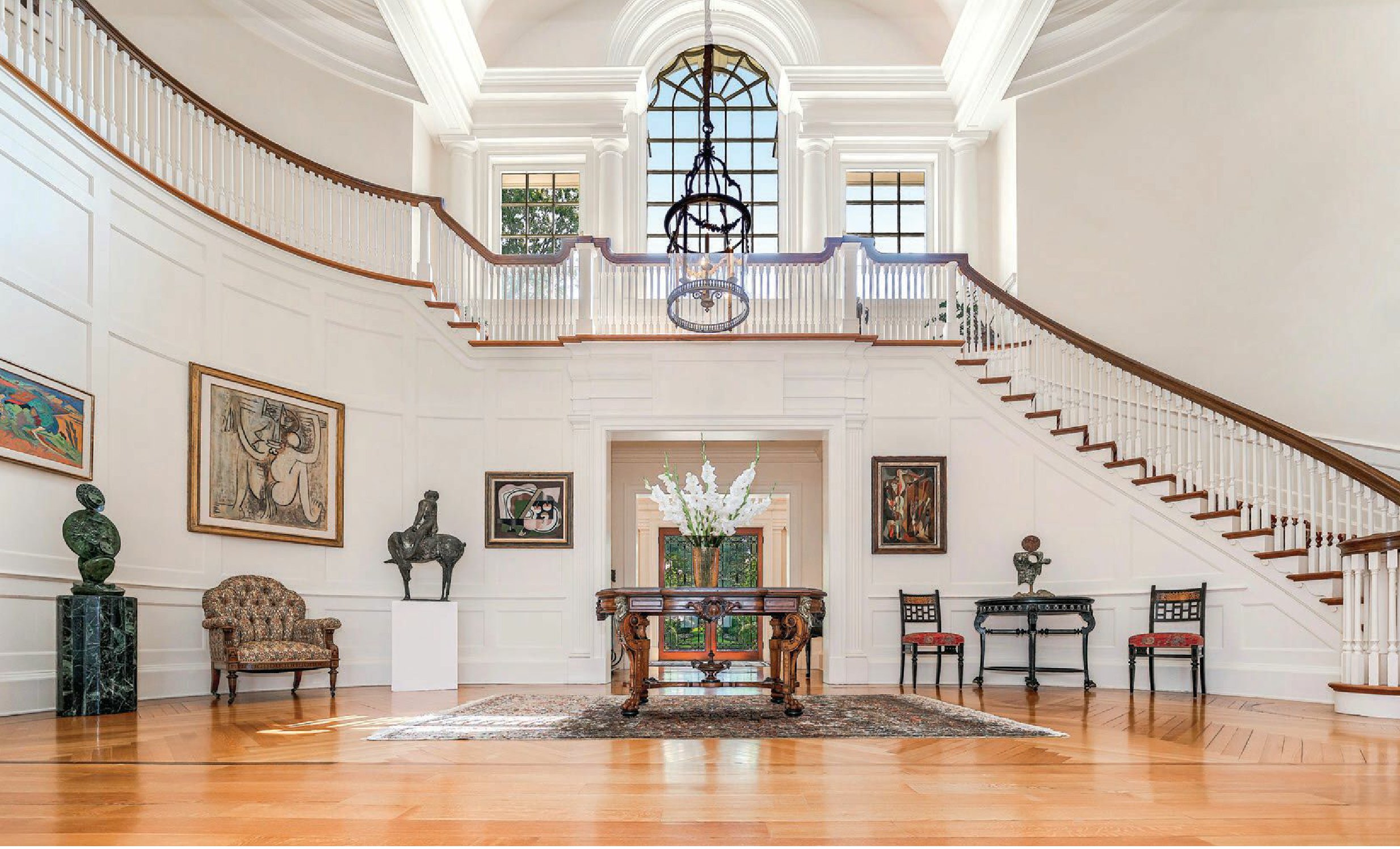 The commanding great stair hall PHOTO BY MIKE AGHACHI/LUXQUE MEDIA