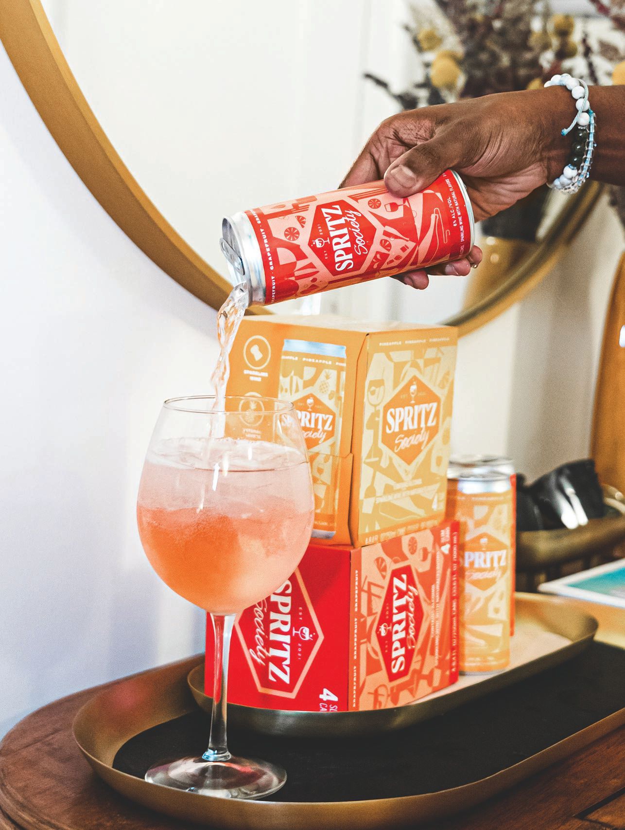 Crack open any of Spritz Society’s five flavors of canned cocktails PHOTO COURTESY OF THE BRANDS