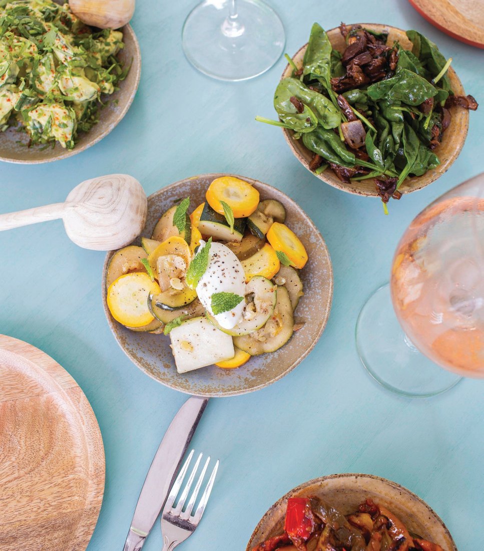 A selection of vegetable small plates featuring summer squash, Persian cucumbers, sunburst peppers and a mushroom trio PHOTO BY ERICA GANNETT