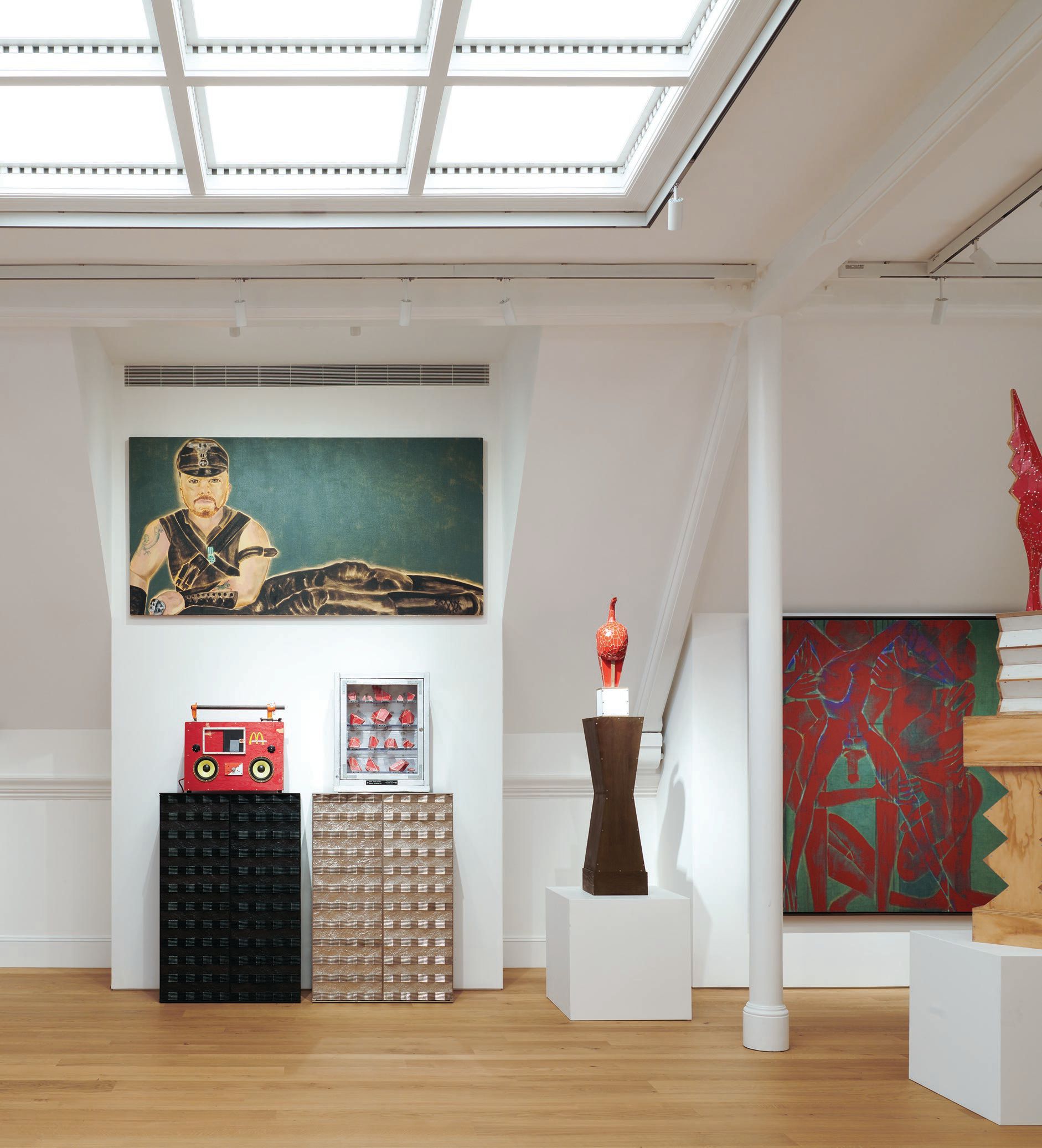 Upstairs at the Peter Marino Art Foundation, the Meeting Room features a portrait of Peter Marino by Francesco Clemente (center) and several sculptures by Tom Sachs. PHOTO © JASON SCHMIDT/COURTESY OF PETER MARINO ARCHITECT