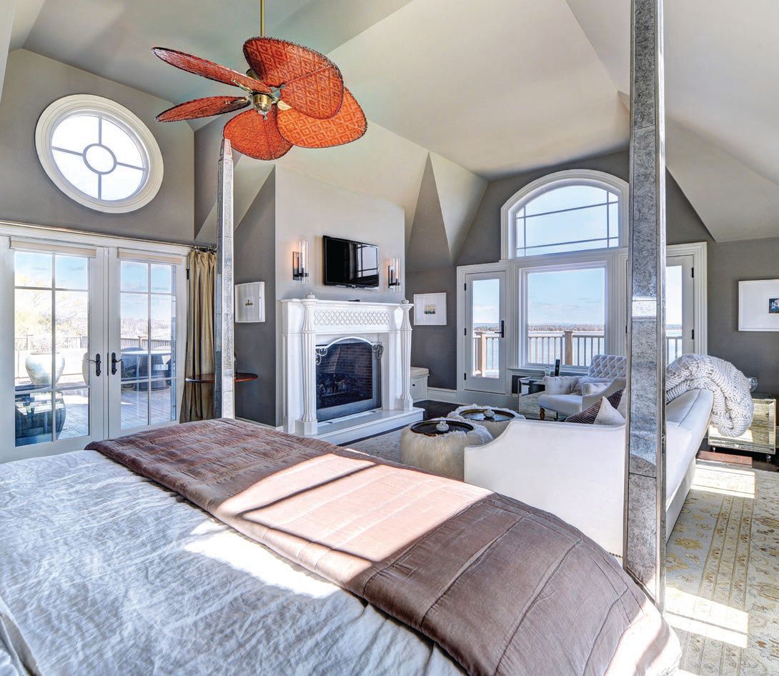 The primary wing features vaulted ceilings, a fireplace and sitting area, a steam shower, a Jacuzzi and wraparound deck PHOTO COURTESY OF THE CORCORAN GROUP