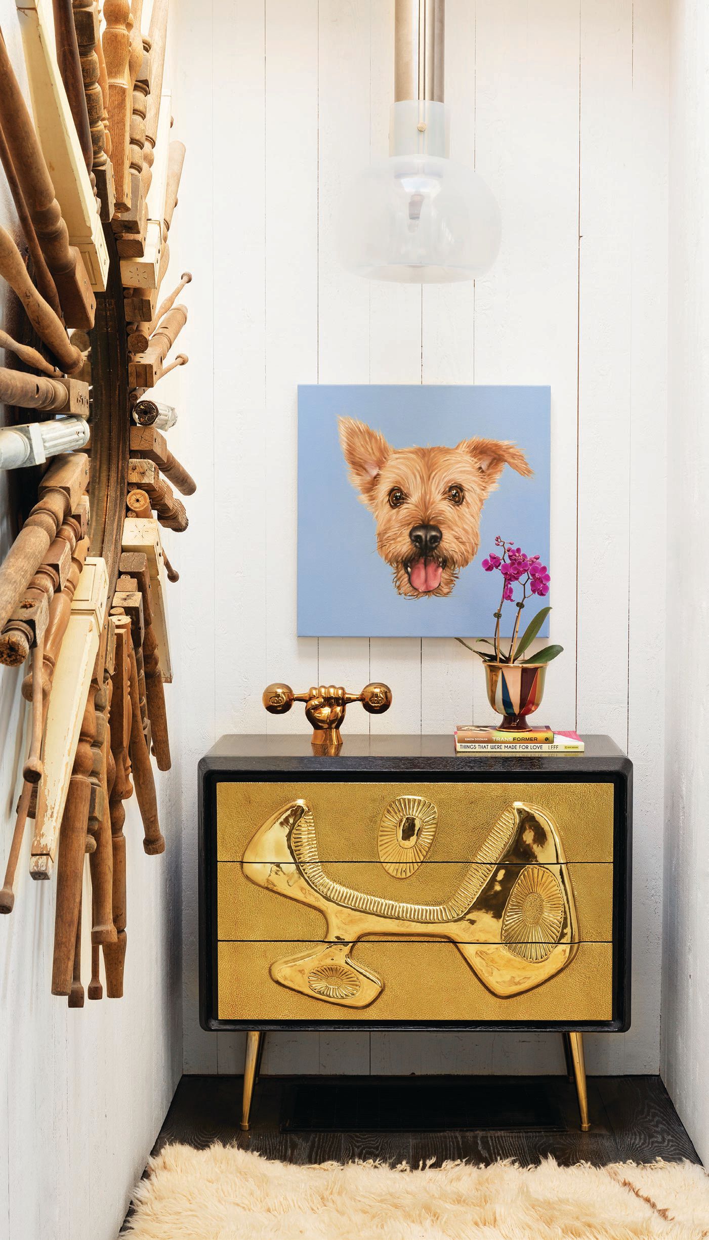 A painting of FoxyLady presides over a Jonathan Adler Torino Triangles bowl, Reform three-drawer chest and Doonan’s upcoming book, Transformer: A Story of Glitter, Glam Rock and Loving Lou Reed. PHOTOGRAPHED BY GIEVES ANDERSON