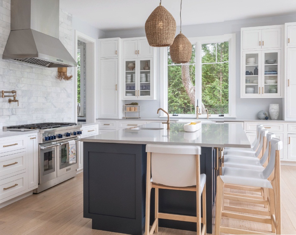 The kitchen features custom cabinets, fixtures from Brizo and stools sourced from CB2. PHOTOGRAPHED BY TIM HILL