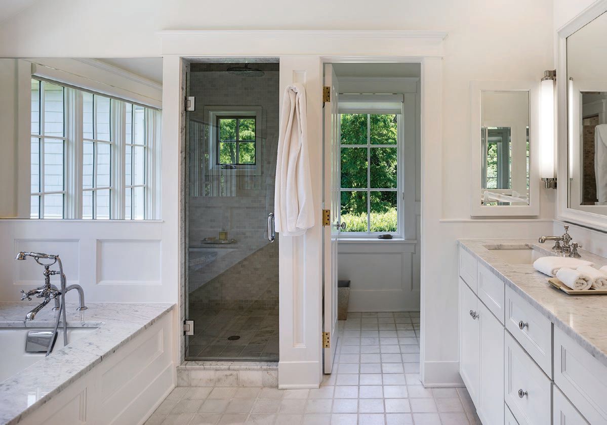 A tub and walk-in shower await in the primary bathroom. PHOTO COURTESY OF LIFESTYLE PRODUCTION GROUP, LLC