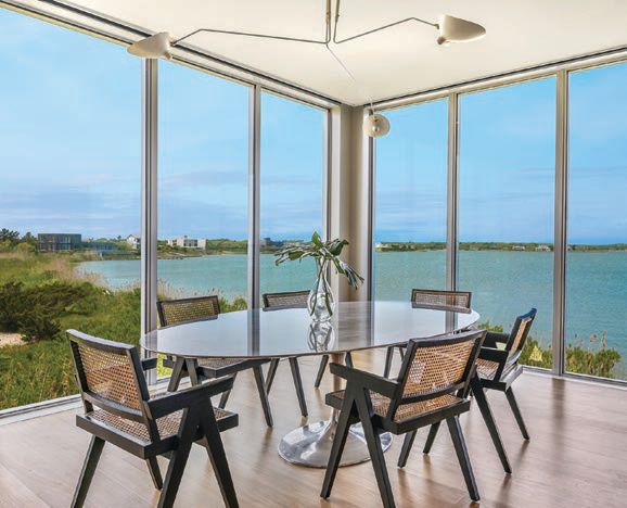 This waterside wonder effortlessly fuses environmental consciousness and modern sophistication with its floor-to-ceiling glass doors and windows, solar panels, elevator, custom kitchen design and so much more. PHOTO COURTESY OF THE CORCORAN GROUP