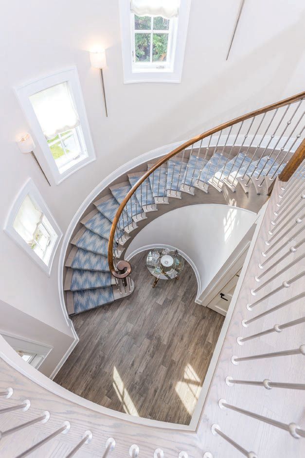 The stunning staircase in one of the firm’s recent waterfront builds in Eastport PHOTO BY MIRANDA GATEWOOD PHOTOGRAPHY
